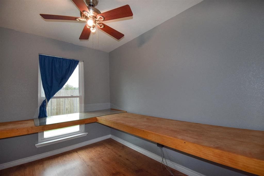 a dining room with a wooden table and a window