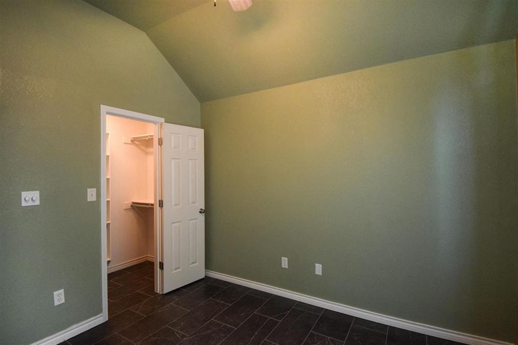 a room with green walls and a white door and a closet