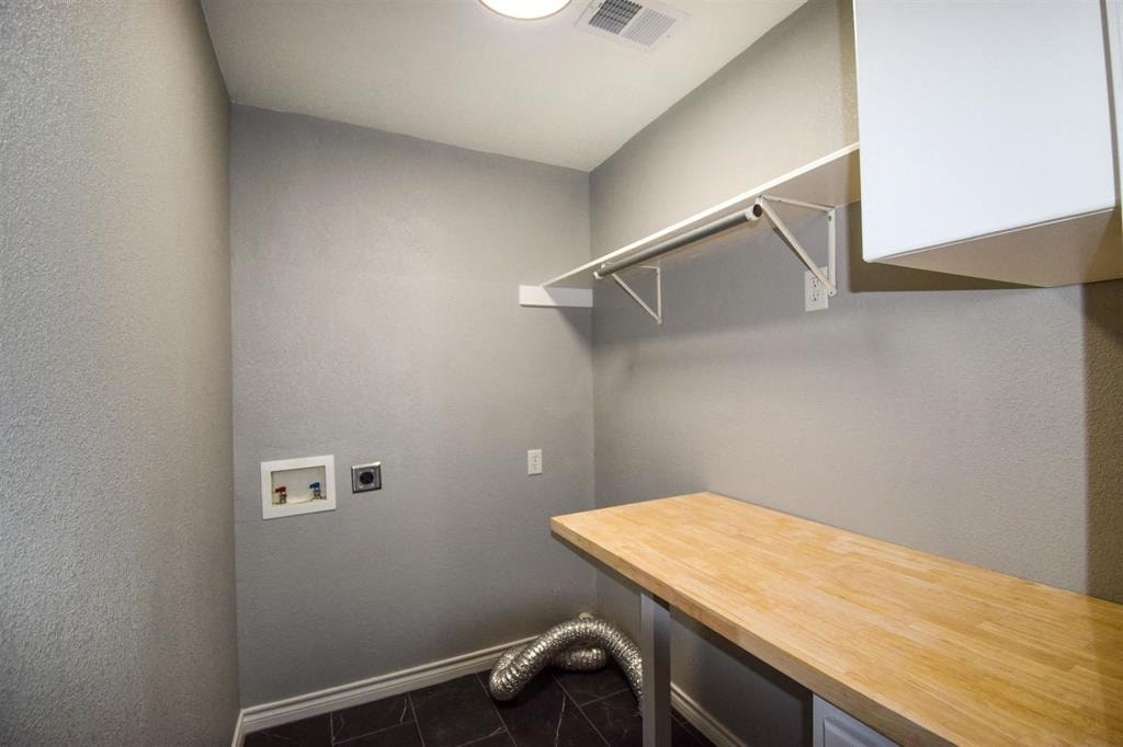 a kitchen with a wooden counter top and a sink