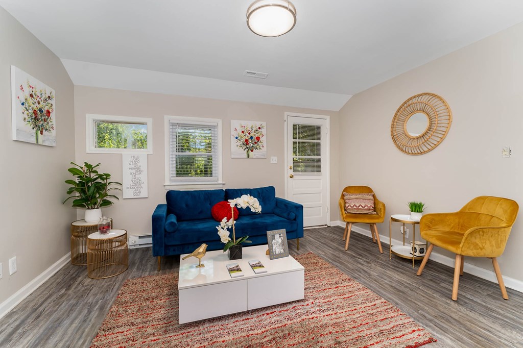 a living room with a blue couch and a coffee table