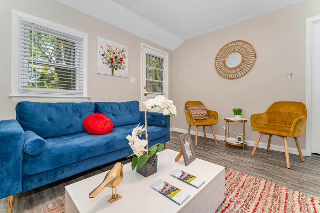 a living room with a blue couch
