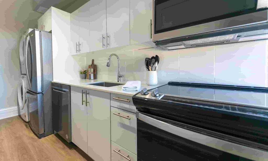 a kitchen with a sink and a refrigerator