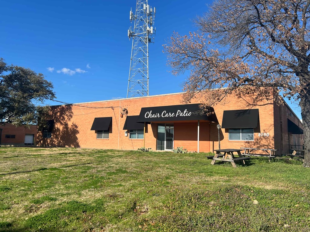 a building with a picnic table in front of it