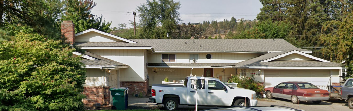 a house with a truck parked in front of it