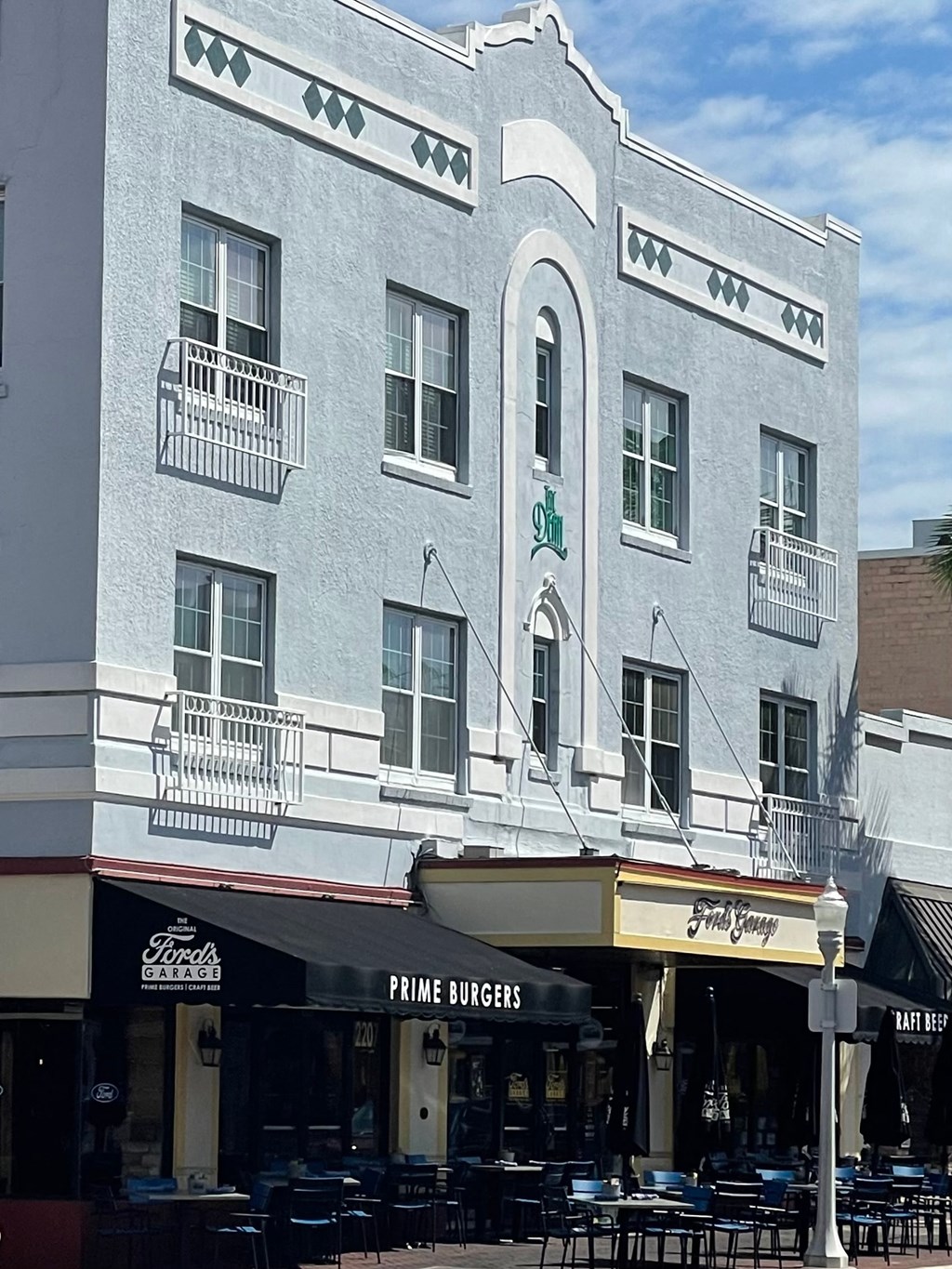 a white building with a restaurant in front of it
