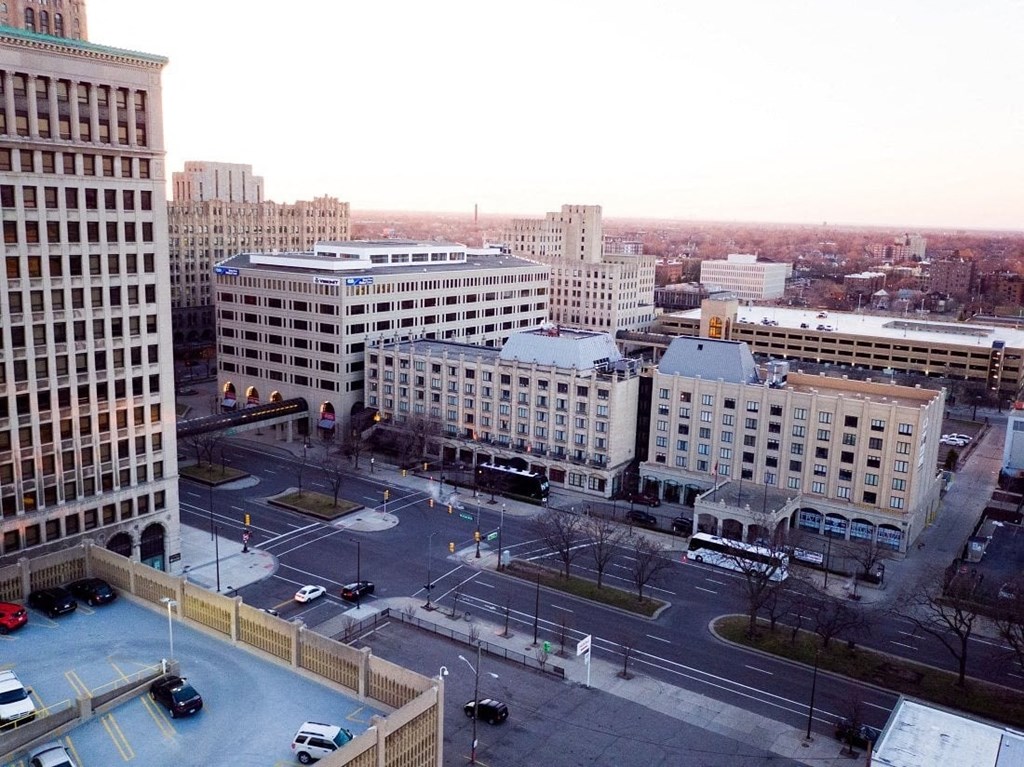 a view of a city from above of a parking lot