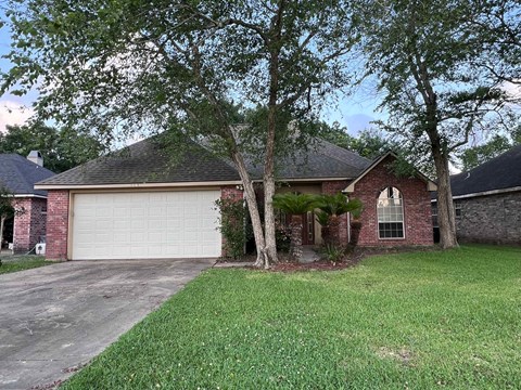 a brick house with a white garage door