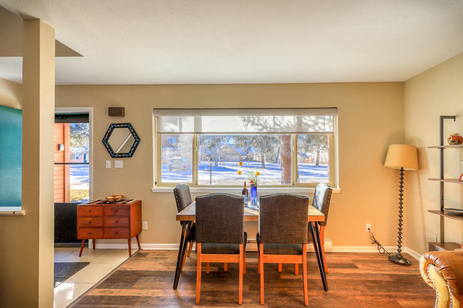 a dining room with a table and a window