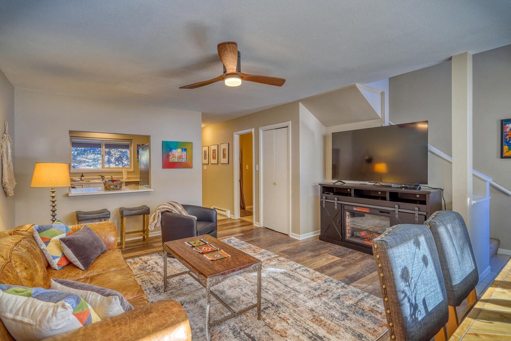 a living room with a couch and a tv