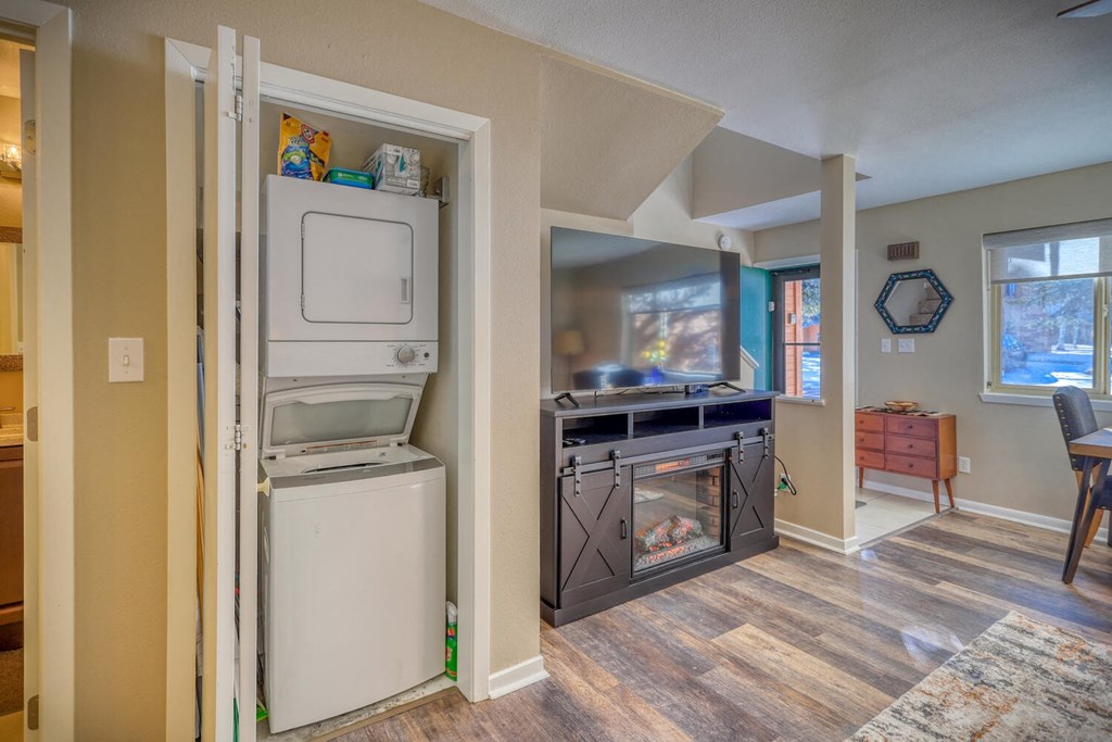 a kitchen with a washer and dryer next to a door