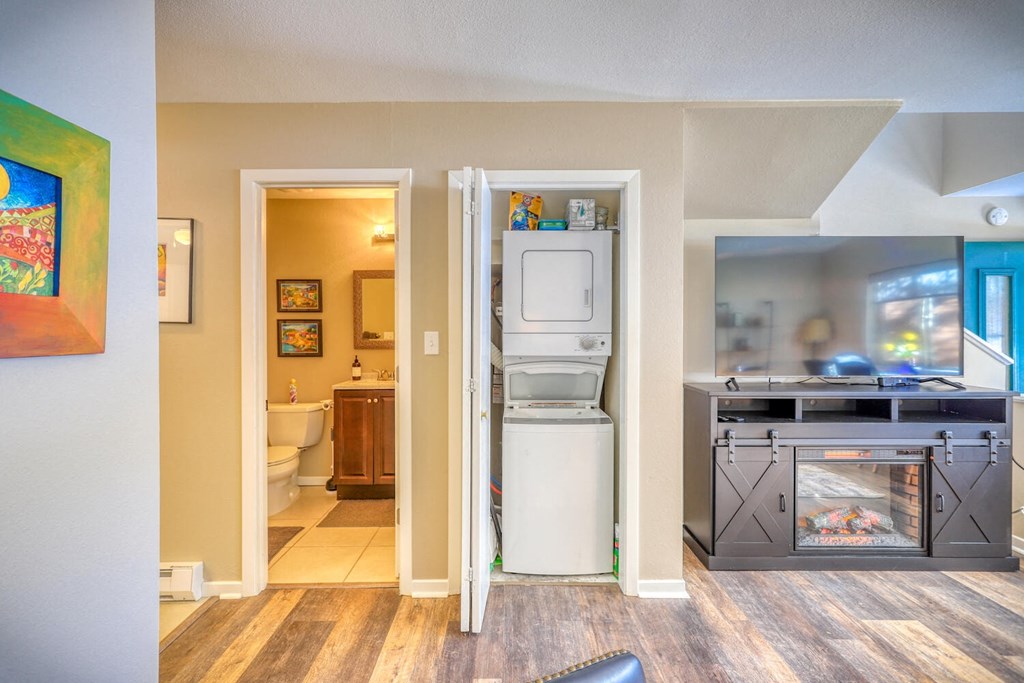 a view of a kitchen with a washer and dryer and a laundry room