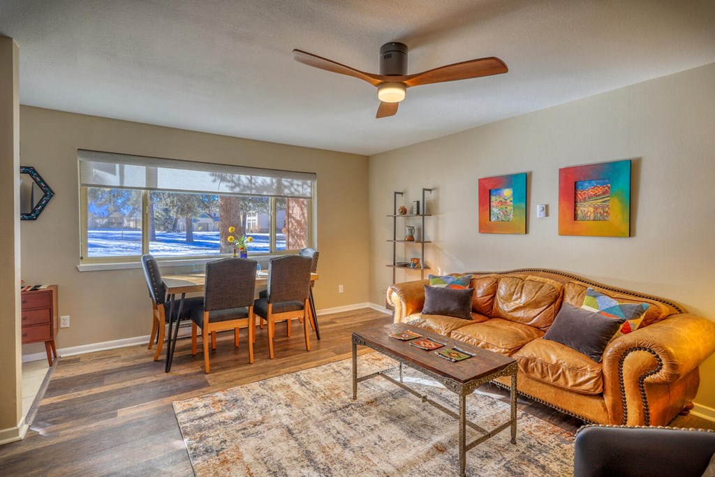 a living room with a couch and a dining room table