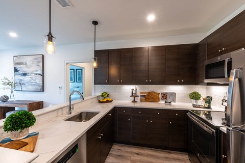 a kitchen with a large counter top and a sink