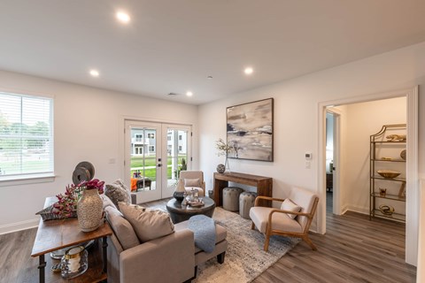 a living room with couches and chairs and a table
