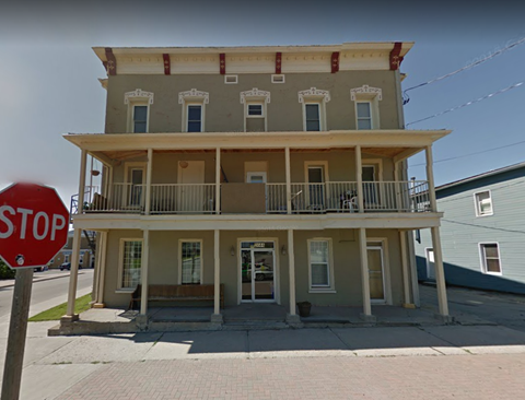 a building with a stop sign in front of it