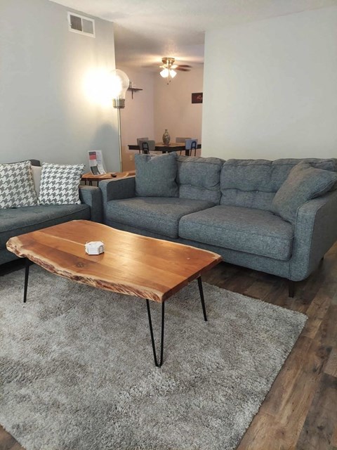 a living room with couches and a coffee table