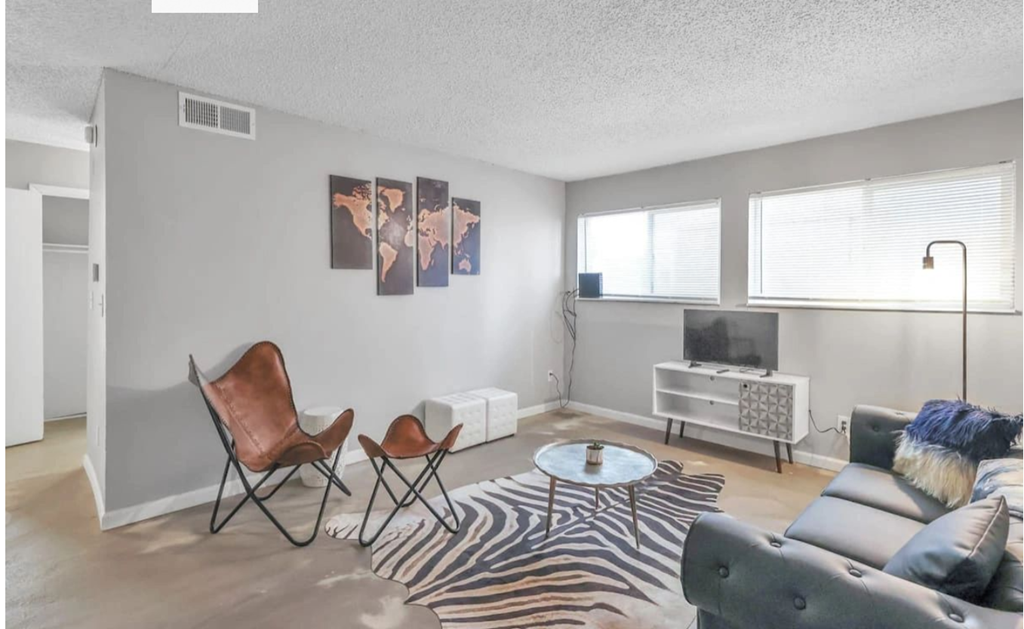 a living room with a couch and a tv