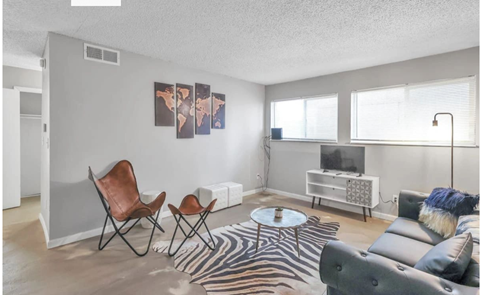 a living room with a couch and a tv