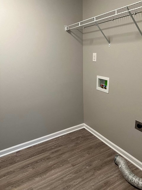 a room with a closet and a hanger on the wall
