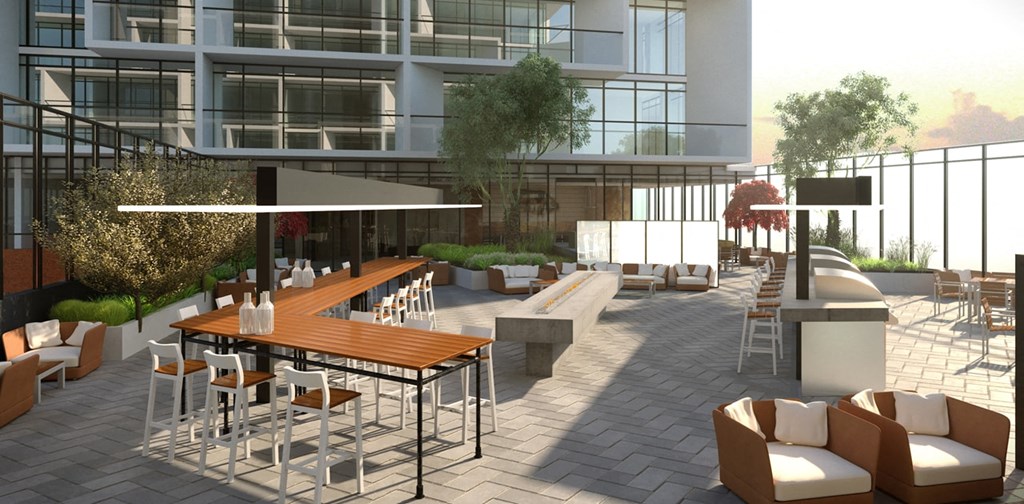 a rendering of a patio with tables and chairs in front of an office building