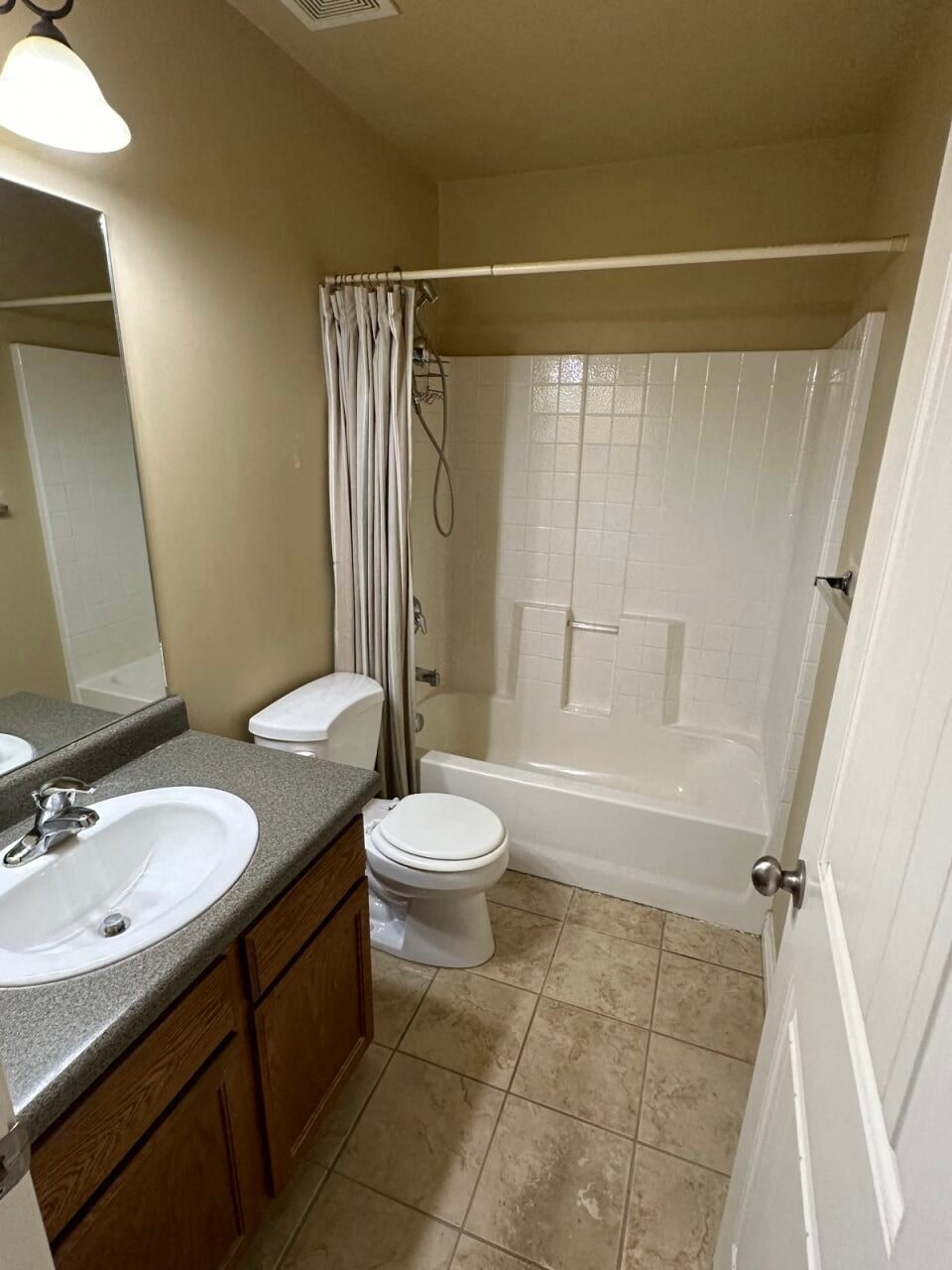 a bathroom with a sink toilet and a shower