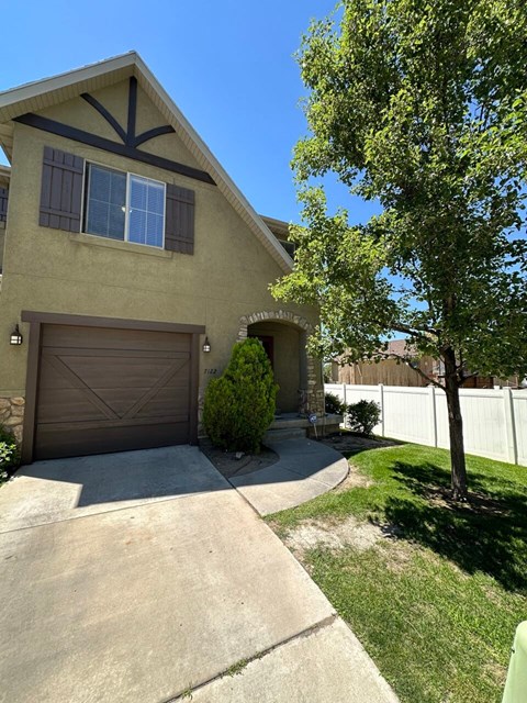 a house with a driveway and a garage door