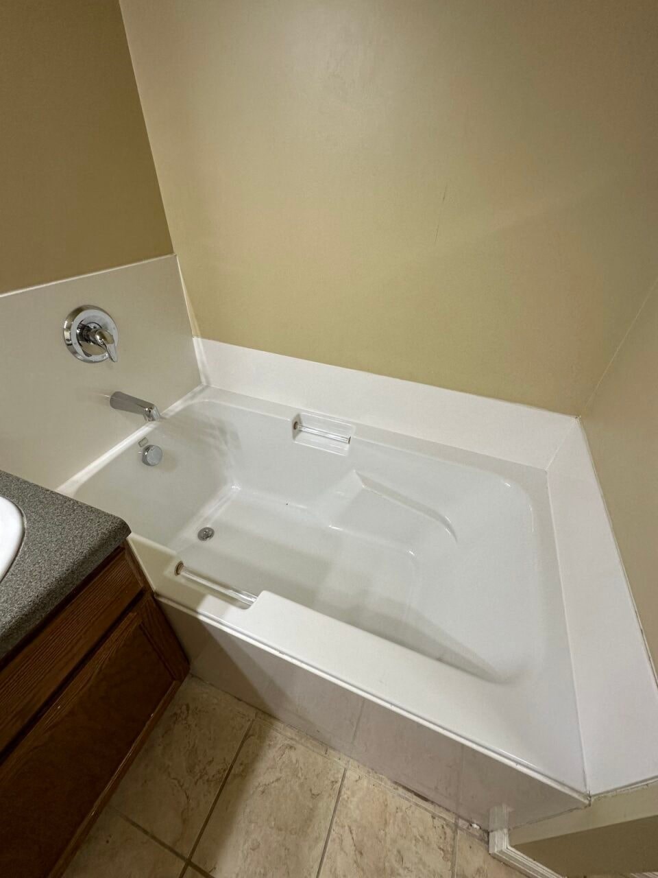 a bathroom with a white tub and a sink