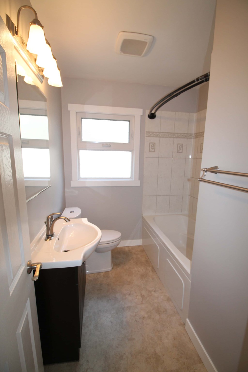 a bathroom with a sink toilet and a shower