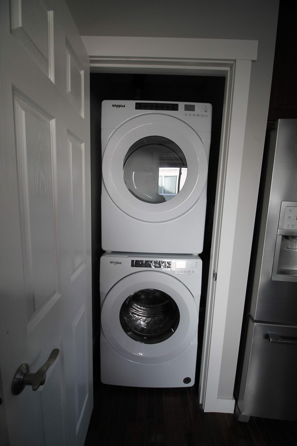 a washing machine and dryer in a small room