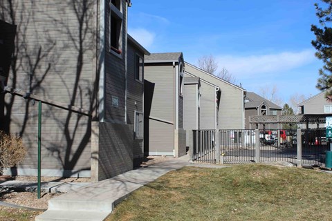 A row of houses with a clear blue sky above them.
