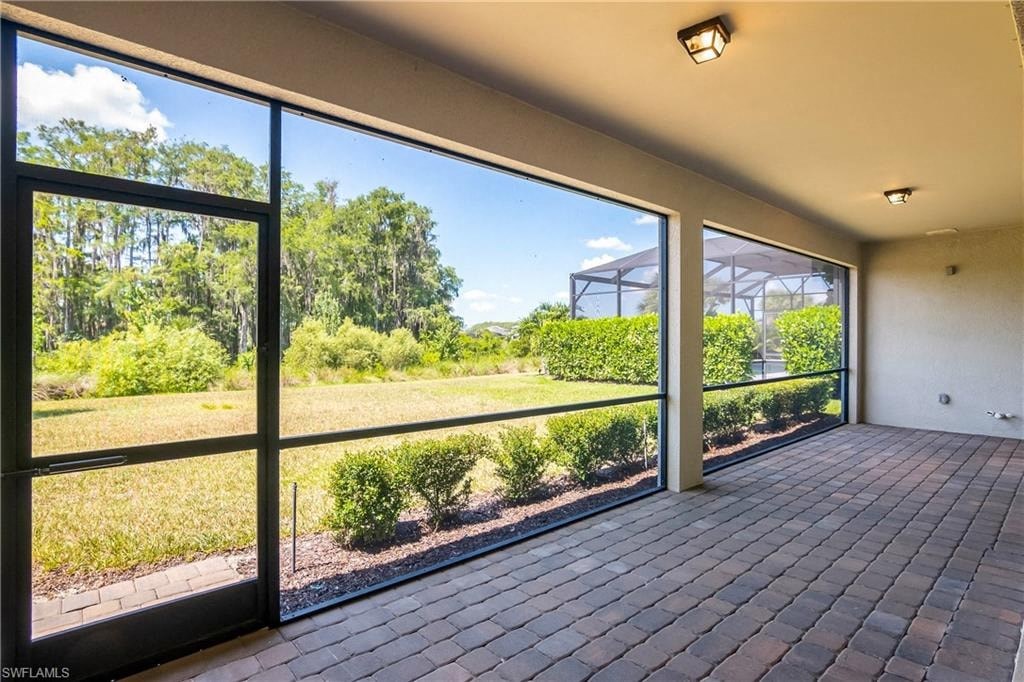 a view of the yard from a large glass door