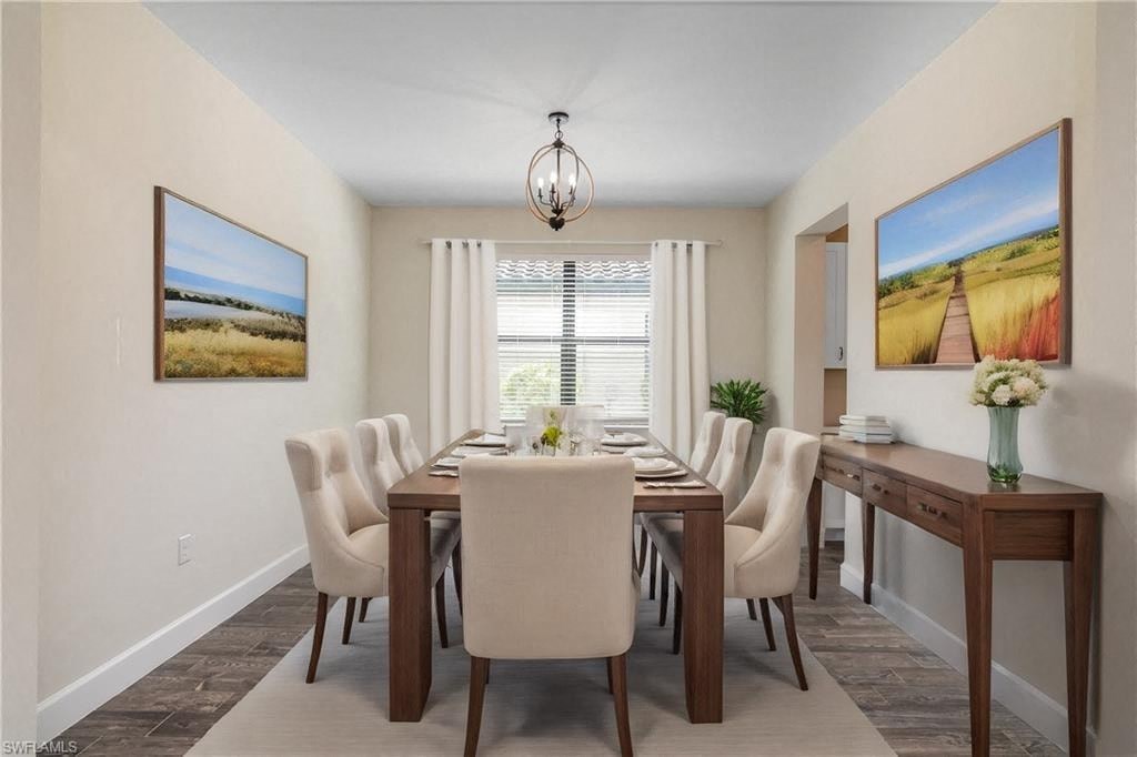 a dining room with a table and chairs