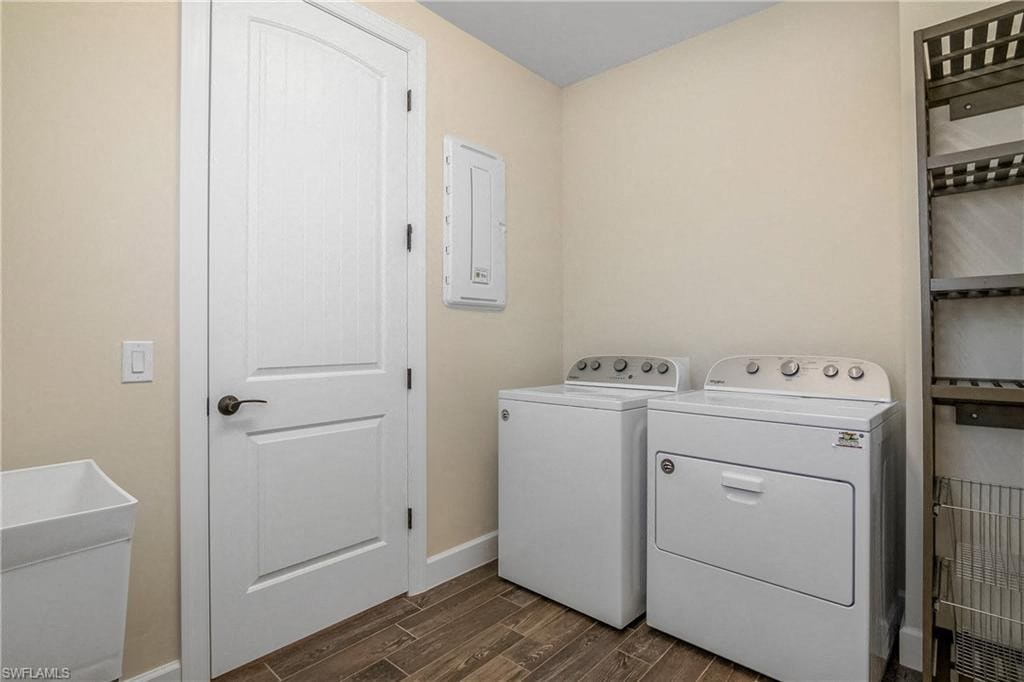 a washer and dryer in a laundry room with a door