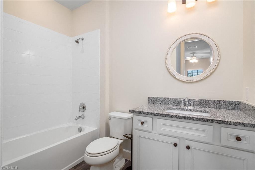a bathroom with a sink toilet and a bath tub