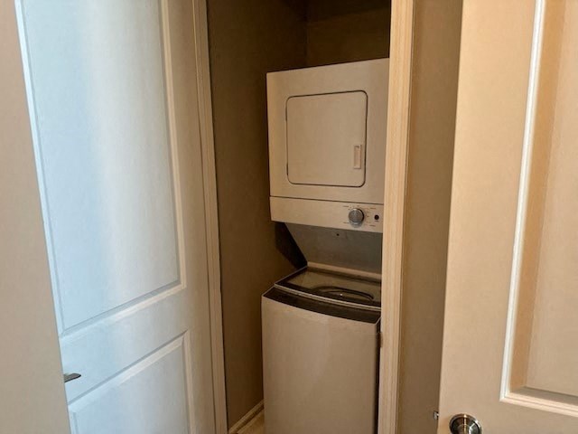 a small bathroom with a toilet and a washing machine