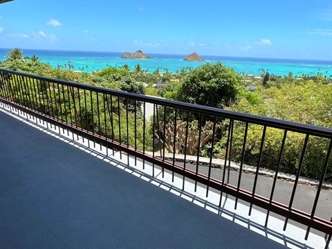 a balcony with a view of the ocean