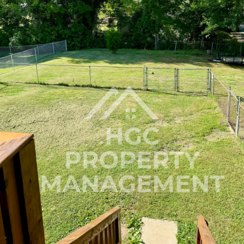 a yard with the words hc property management on it