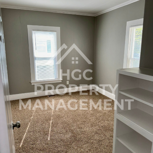 a small bathroom with a carpeted floor and a closet