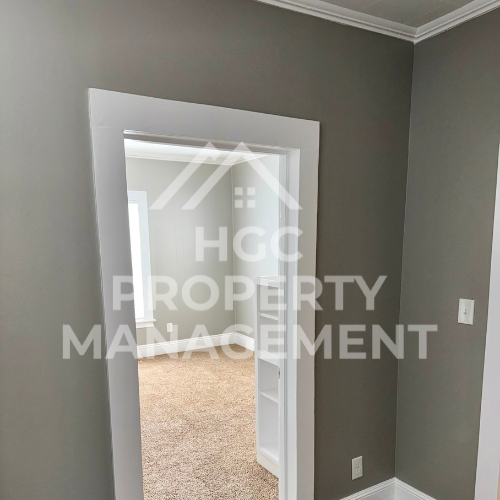 a bedroom with a closet and a door open