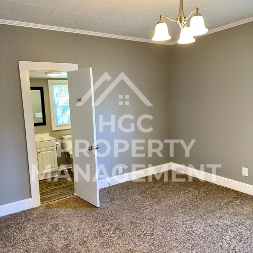 a bedroom with a closet and a bathroom