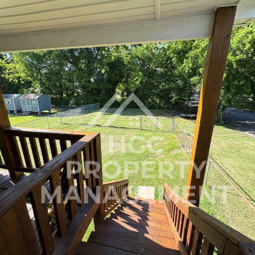 a view of the yard from the porch of a house