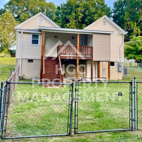 a chain link fence in front of a house