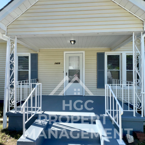 the front of a house with a blue porch with the approved advocacy