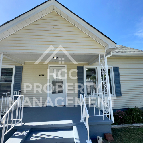 a house with a porch with white railings