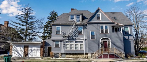 a house with a roof being repaired on the side of it