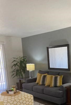 a living room with a couch and a table