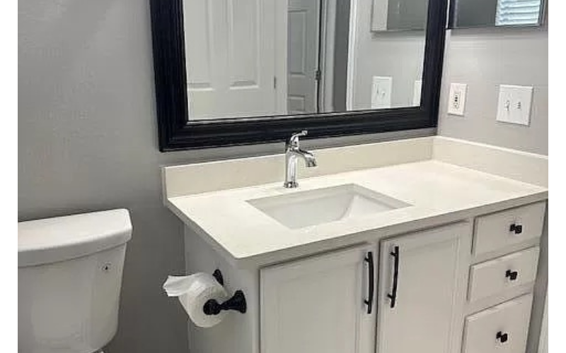 a bathroom with a sink and a mirror
