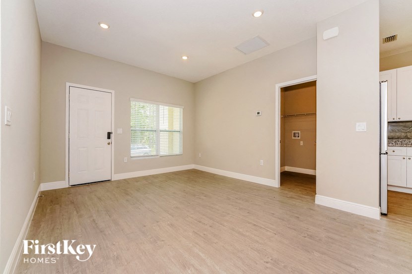 the living room is spacious and ready to be used as a family room