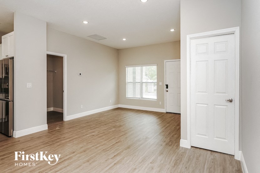 the living room and dining room are open to the kitchen