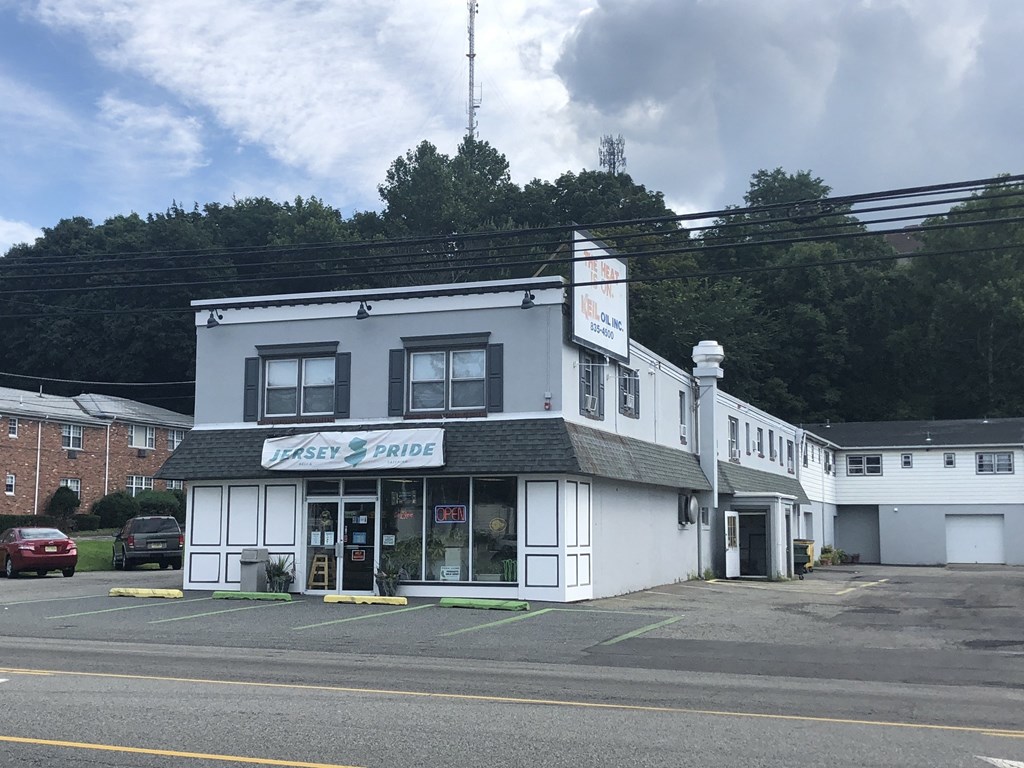 a white building on the corner of a street